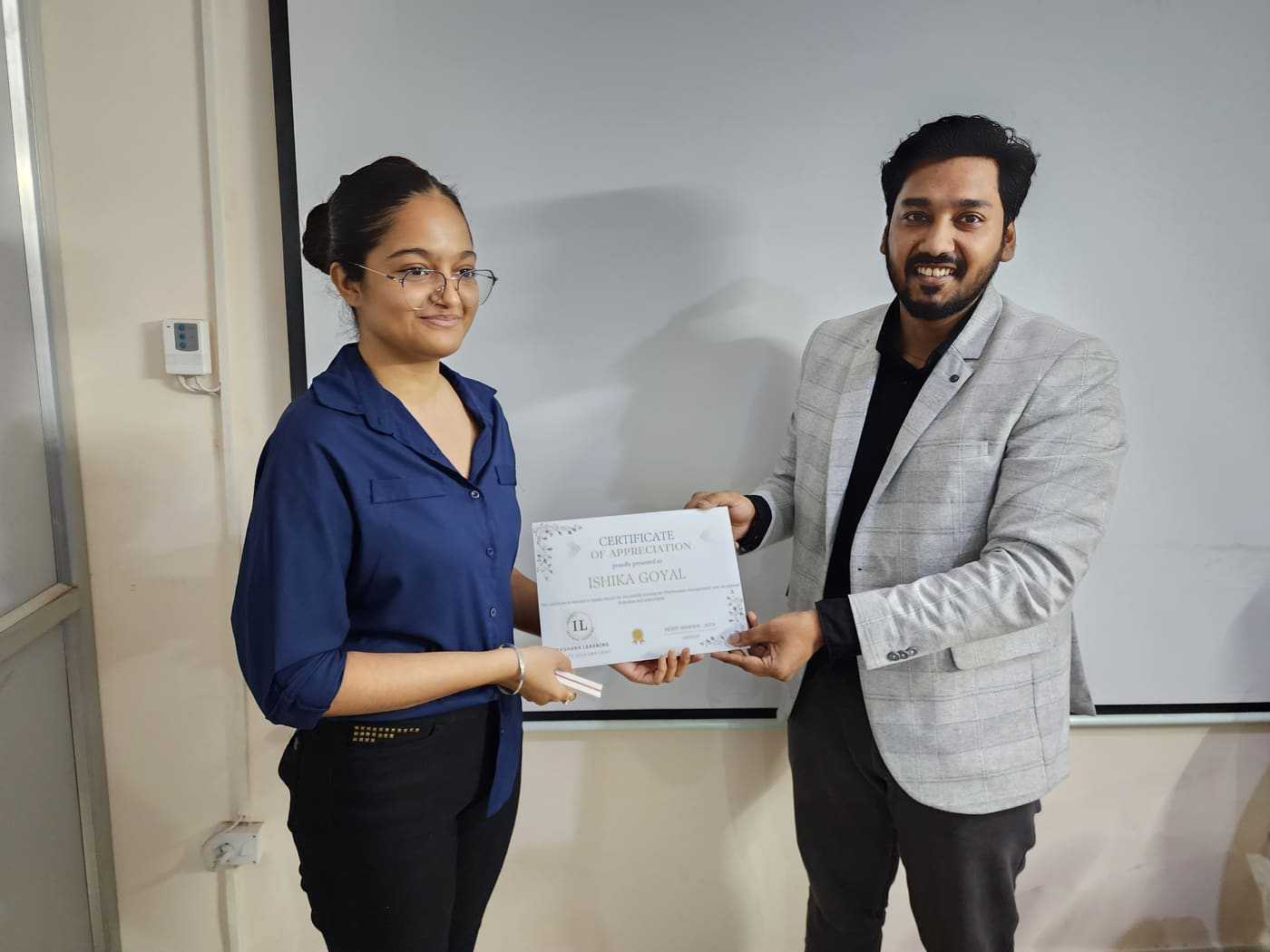 Ishika Goyal receiving ACCA certificate at Ikshana Learning