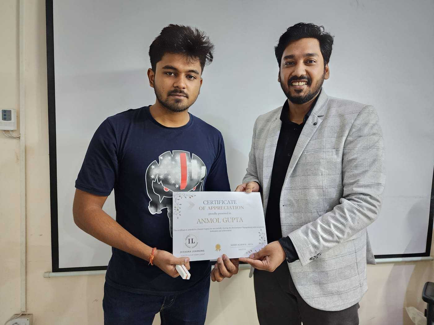 Anmol Gupta receiving ACCA Performance Management certificate from Mohit Agarwal